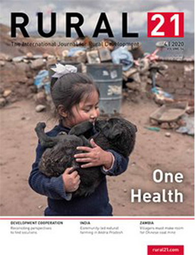 A young girl in a rural setting lovingly holds a small black puppy, symbolizing "One Health" on the Rural 21 cover.